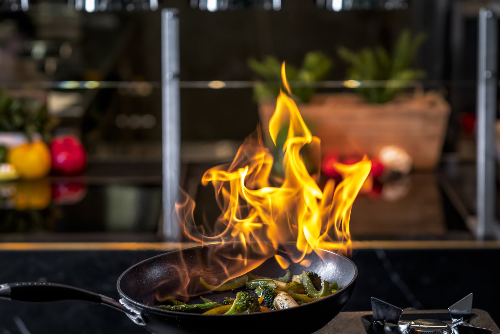 Vegetables flambéed in a pan
